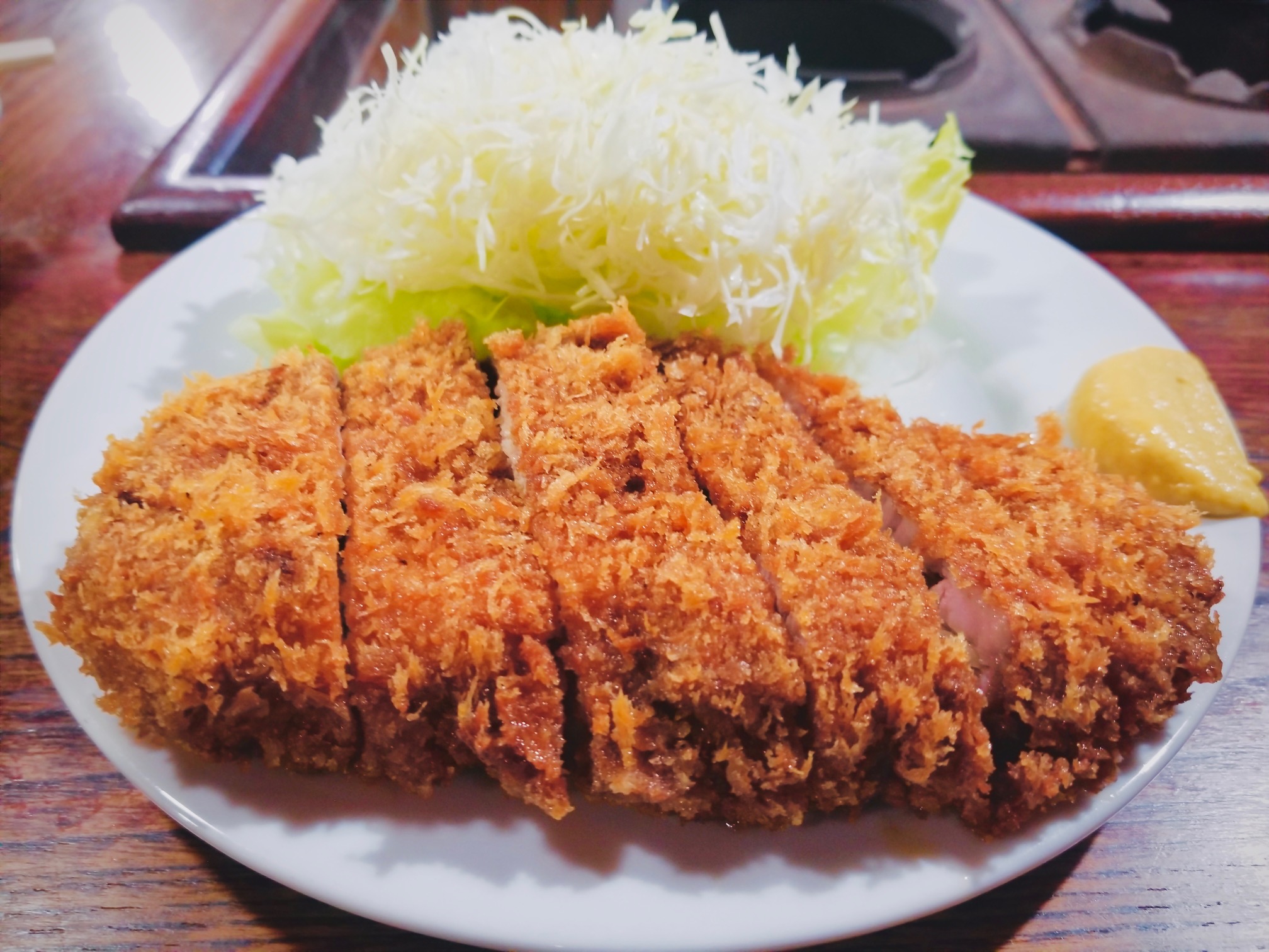 老舗の覚醒と食肉革命：2026年、なぜ「かつ 一」の極厚とんかつに世界中の美食家が殺到するのか